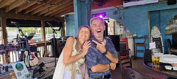 Rita and Jeremy cracking up between songs
