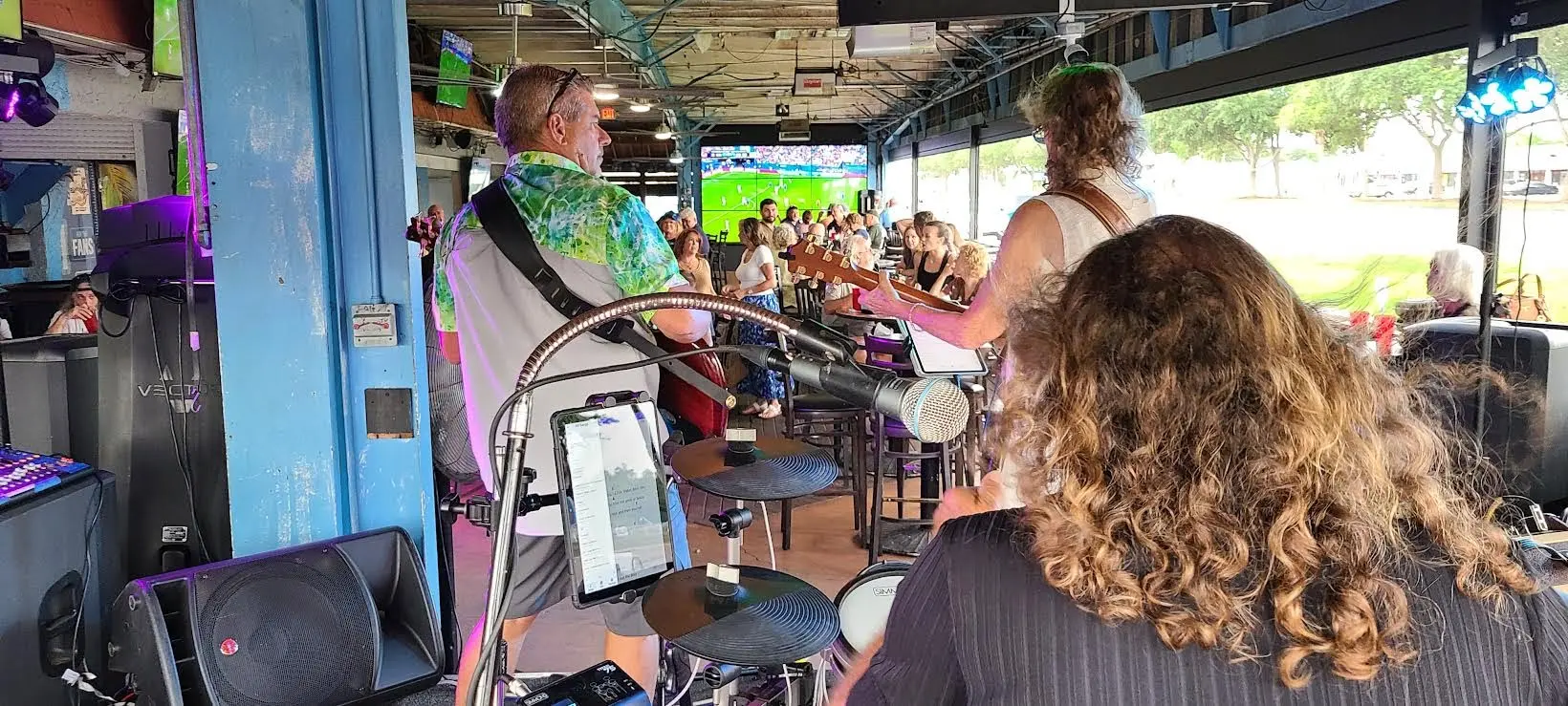 View from behind the drum kit toward the crowd